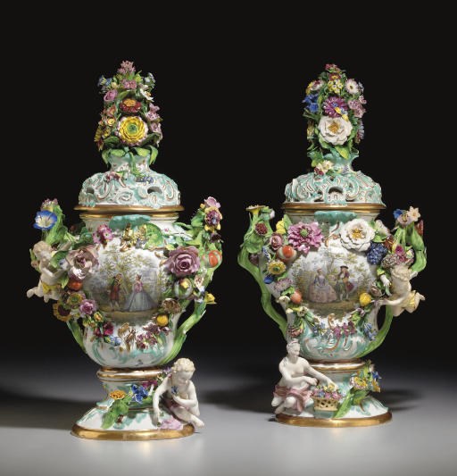 A PAIR OF MEISSEN FLOWER-ENCRUSTED VASES AND COVERS