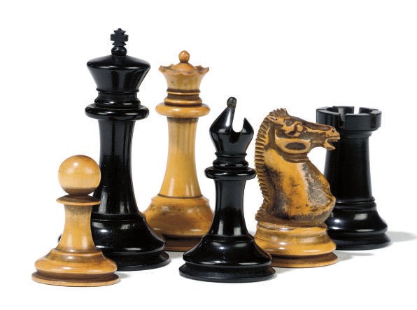 A VICTORIAN STAUNTON EBONY AND BOXWOOD CHESS SET