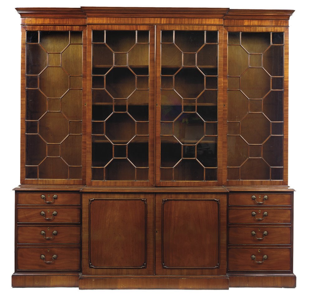 A MAHOGANY BREAKFRONT LIBRARY BOOKCASE