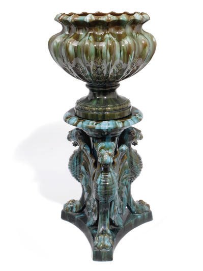 A FRENCH MOTTLED GREEN-GLAZED TERRACOTTA JARDINIERE ON STAND
