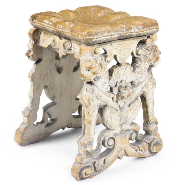 AN ITALIAN CARVED PINE STOOL