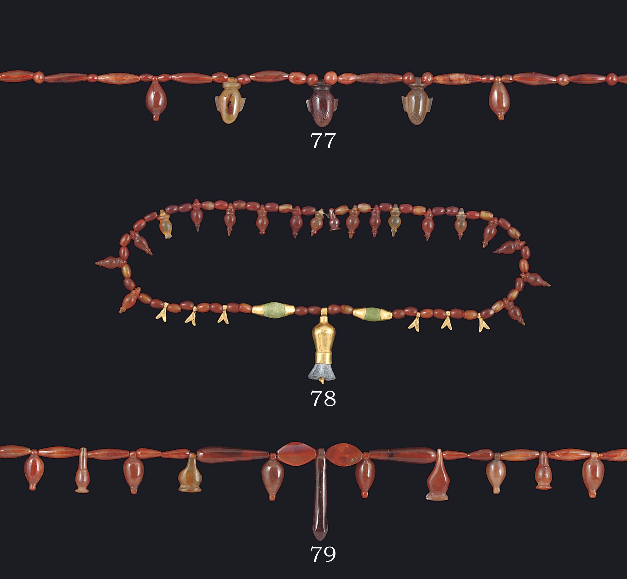 AN EGYPTIAN CORNELIAN BEAD NECKLACE WITH HEART AMULETS