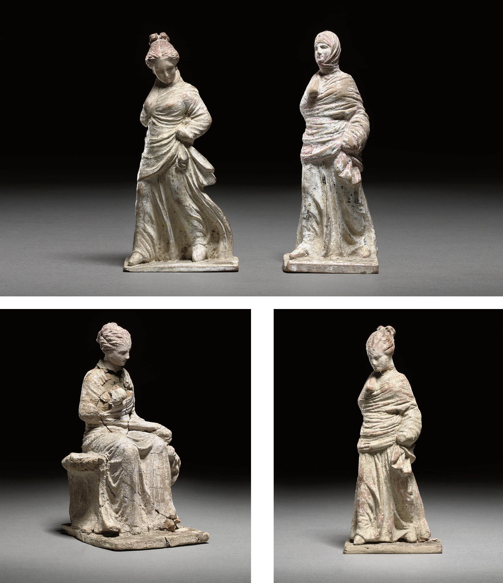 FOUR GREEK STYLE TERRACOTTA DRAPED FEMALE STATUETTES