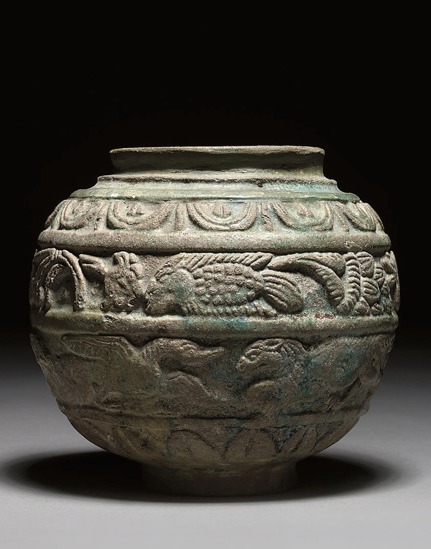 A ROMANO-EGYPTIAN BLUE-GREEN GLAZED COMPOSITION JAR