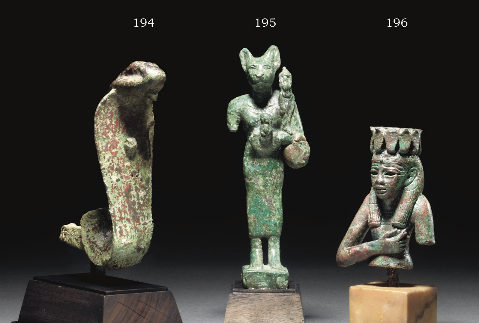 AN EGYPTIAN BRONZE FIGURE OF BASTET