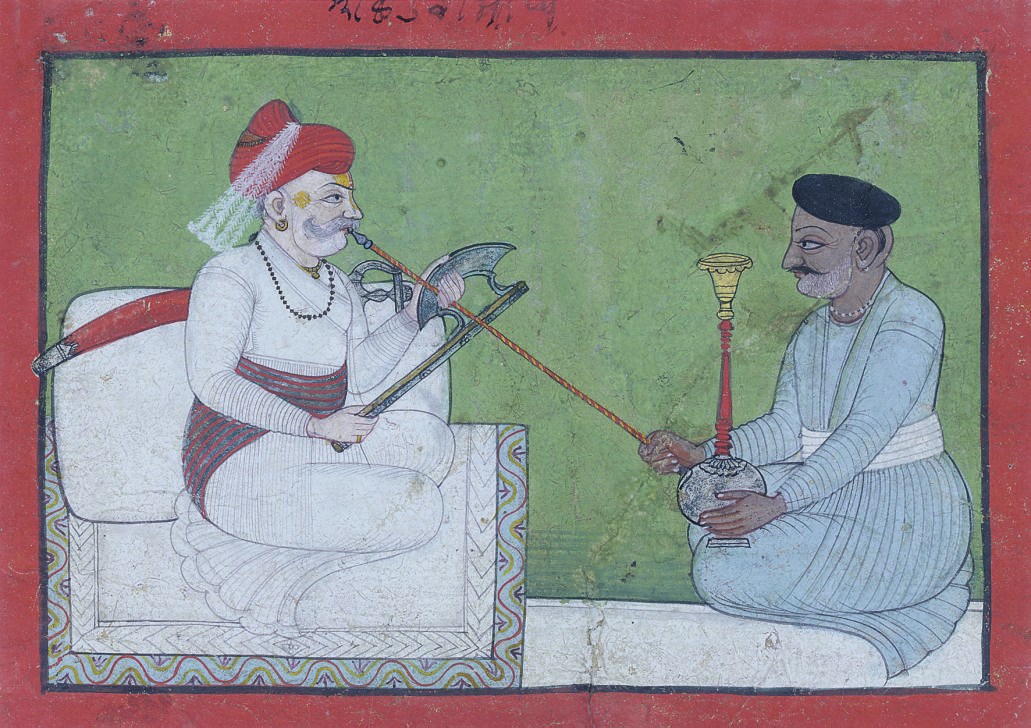 A NOBLE SMOKING A PIPE, MEWAR PAHARI, CIRCA 1820