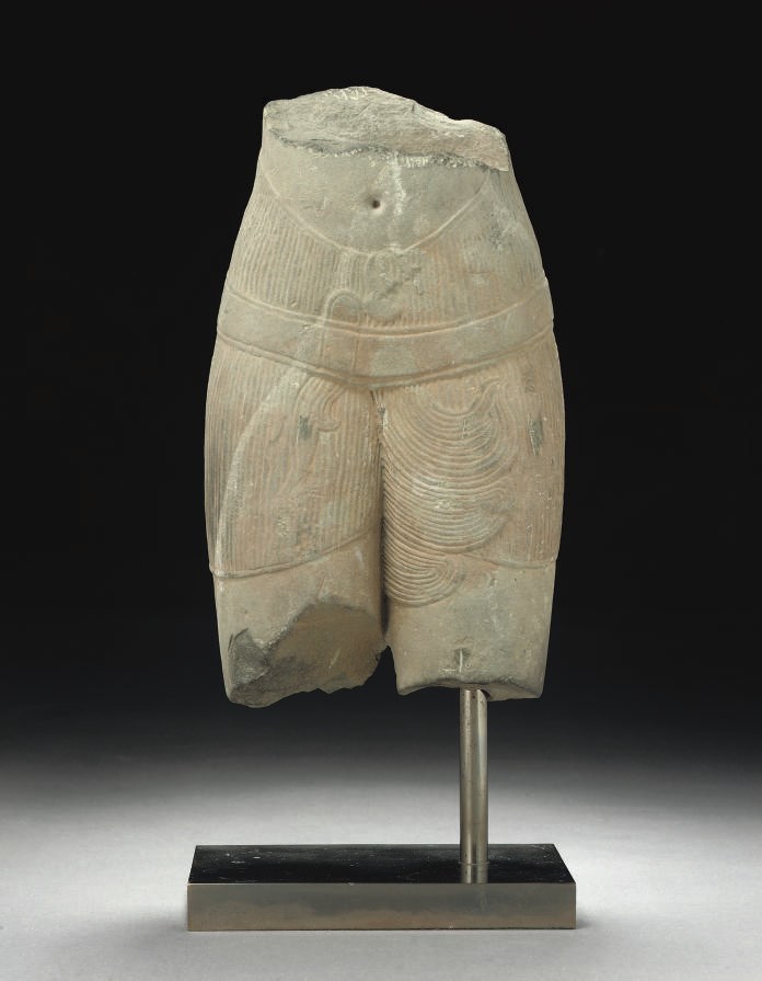 A KHMER SANDSTONE TORSO, ANGKOR PERIOD, 11TH-12TH CENTURY