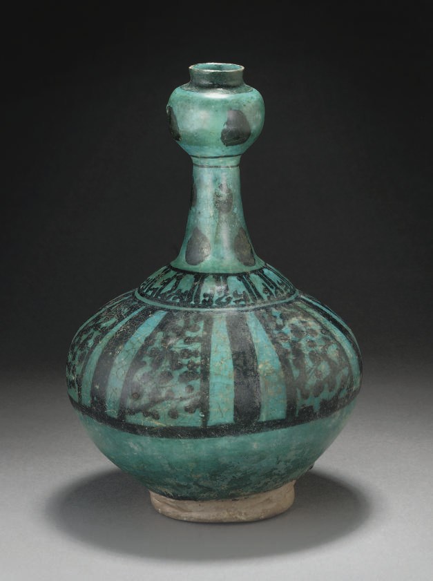 A TURQUOISE AND BLACK UNDERGLAZE FLASK, GURGAN, LATE 12TH-EARLY 13TH CENTURY