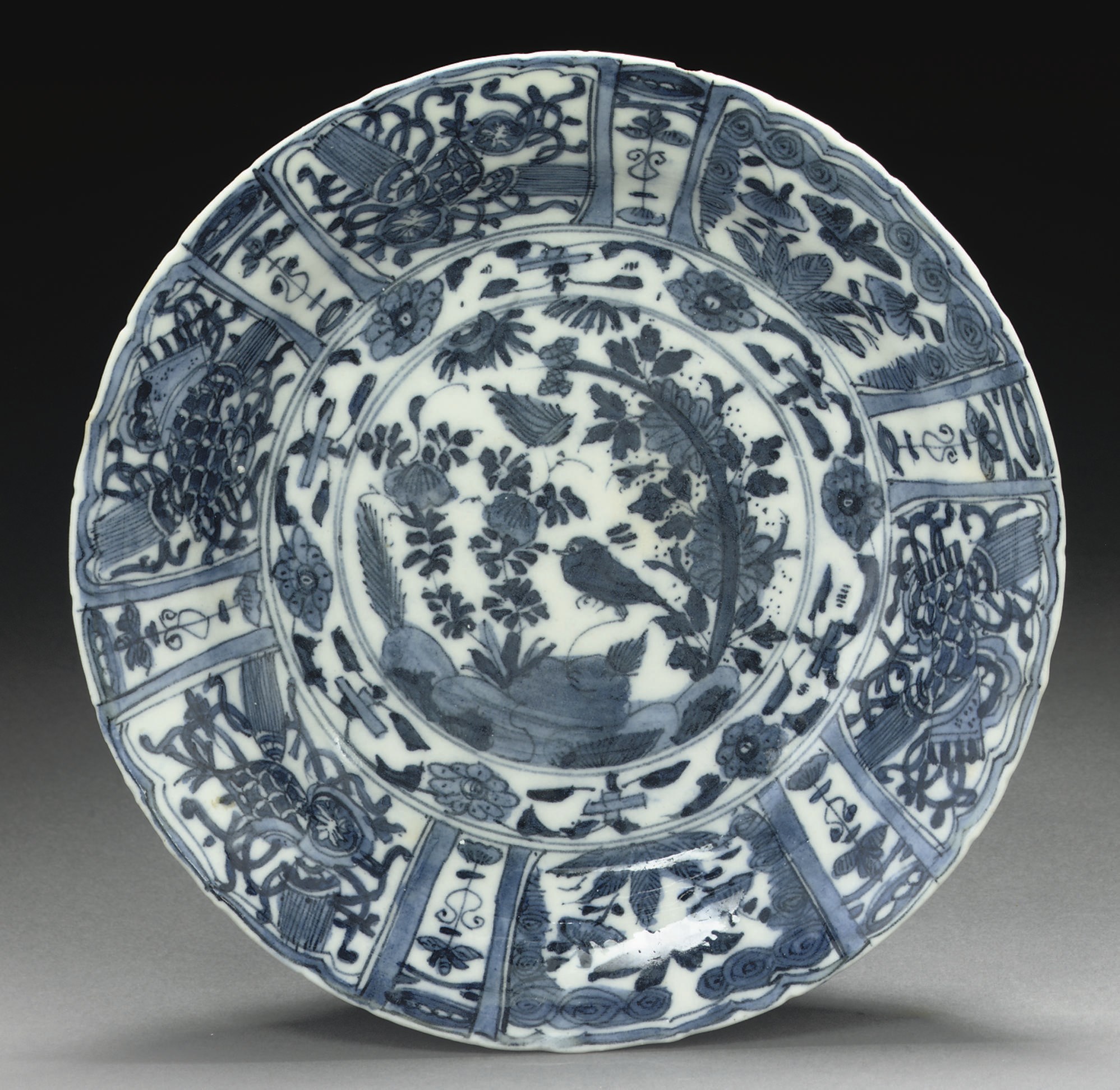 A SAFAVID BLUE AND WHITE DISH, IRAN, 17TH CENTURY