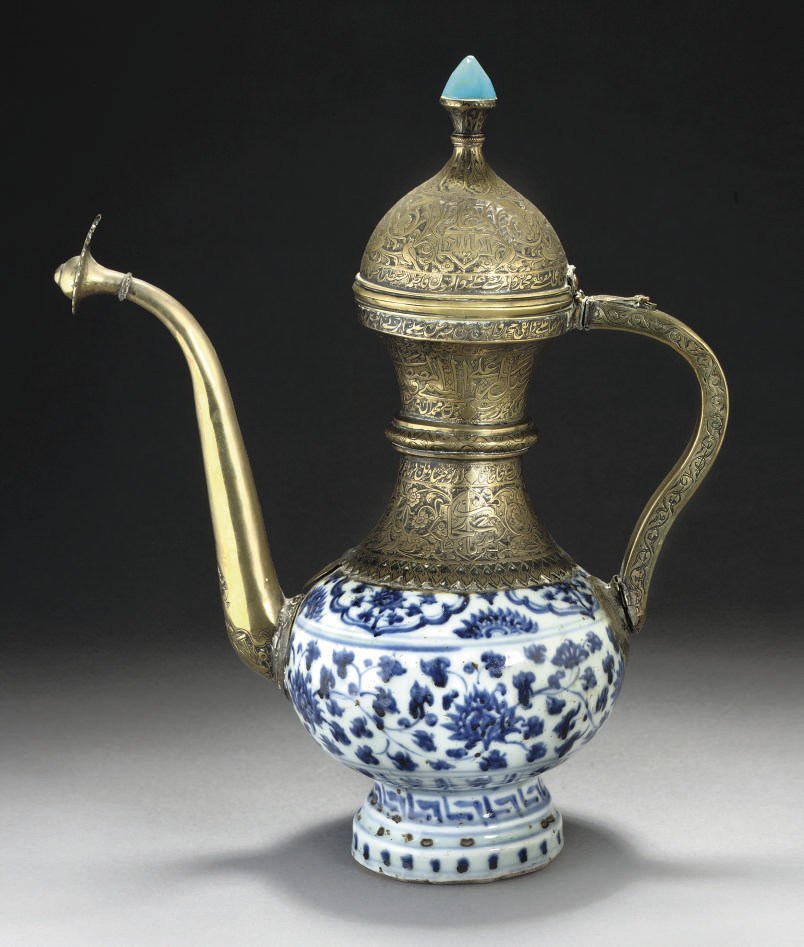 A MING POTTERY EWER WITH SAFAVID BRASS MOUNTS, 16TH AND 17TH CENTURY