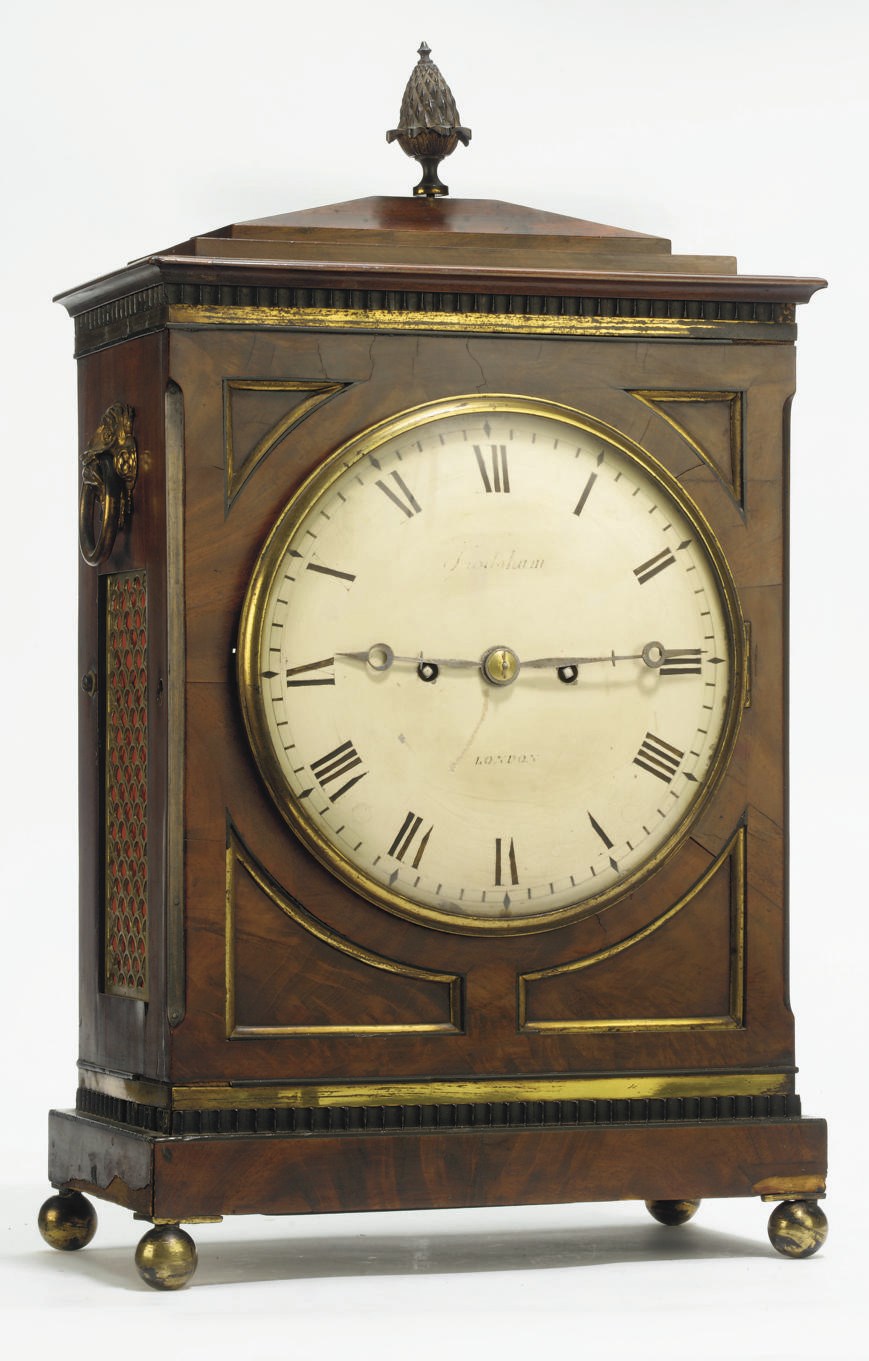 A REGENCY BRASS-MOUNTED MAHOGANY STRIKING TABLE CLOCK