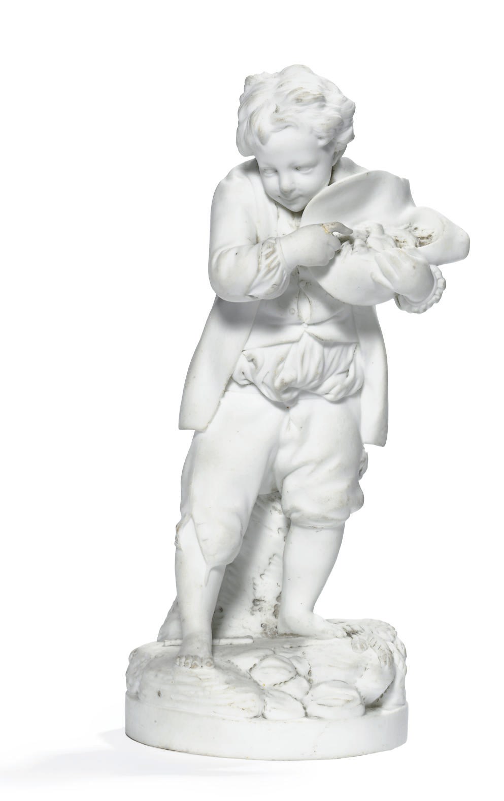 A NIDERVILLER BISCUIT FIGURE OF A PEASANT BOY WITH A BIRD'S NEST IN HIS HAT