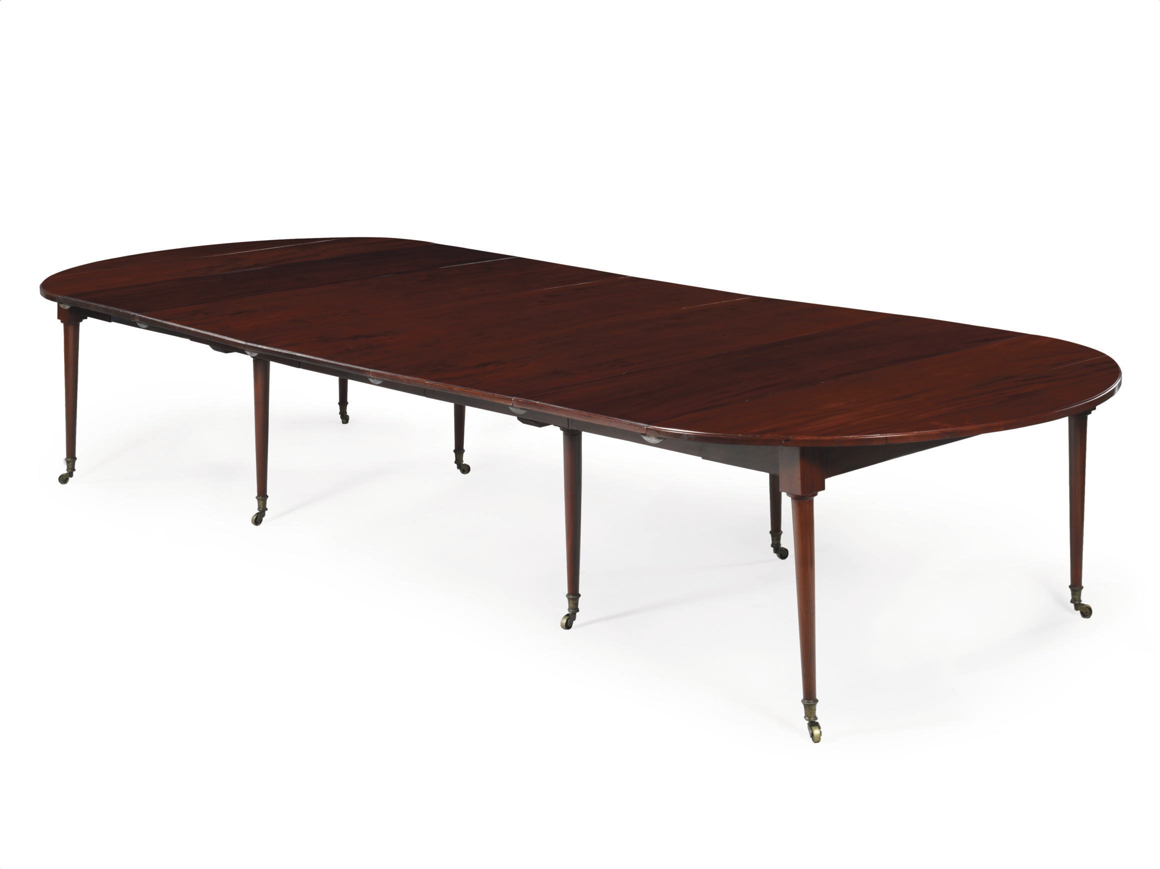 A LOUIS XVI MAHOGANY EXTENDING DINING TABLE