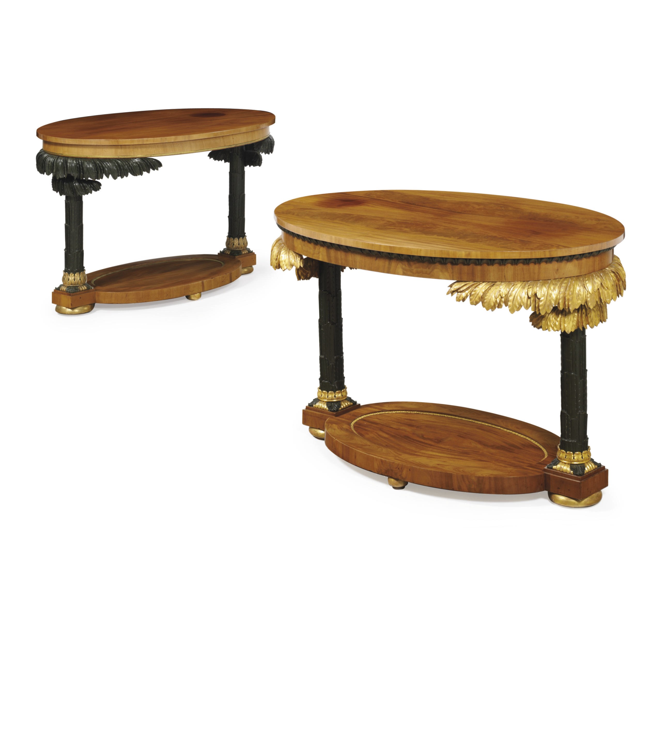 TWO CENTRAL EUROPEAN MAHOGANY, PARCEL-EBONIZED AND PARCEL-GILT CENTER TABLES