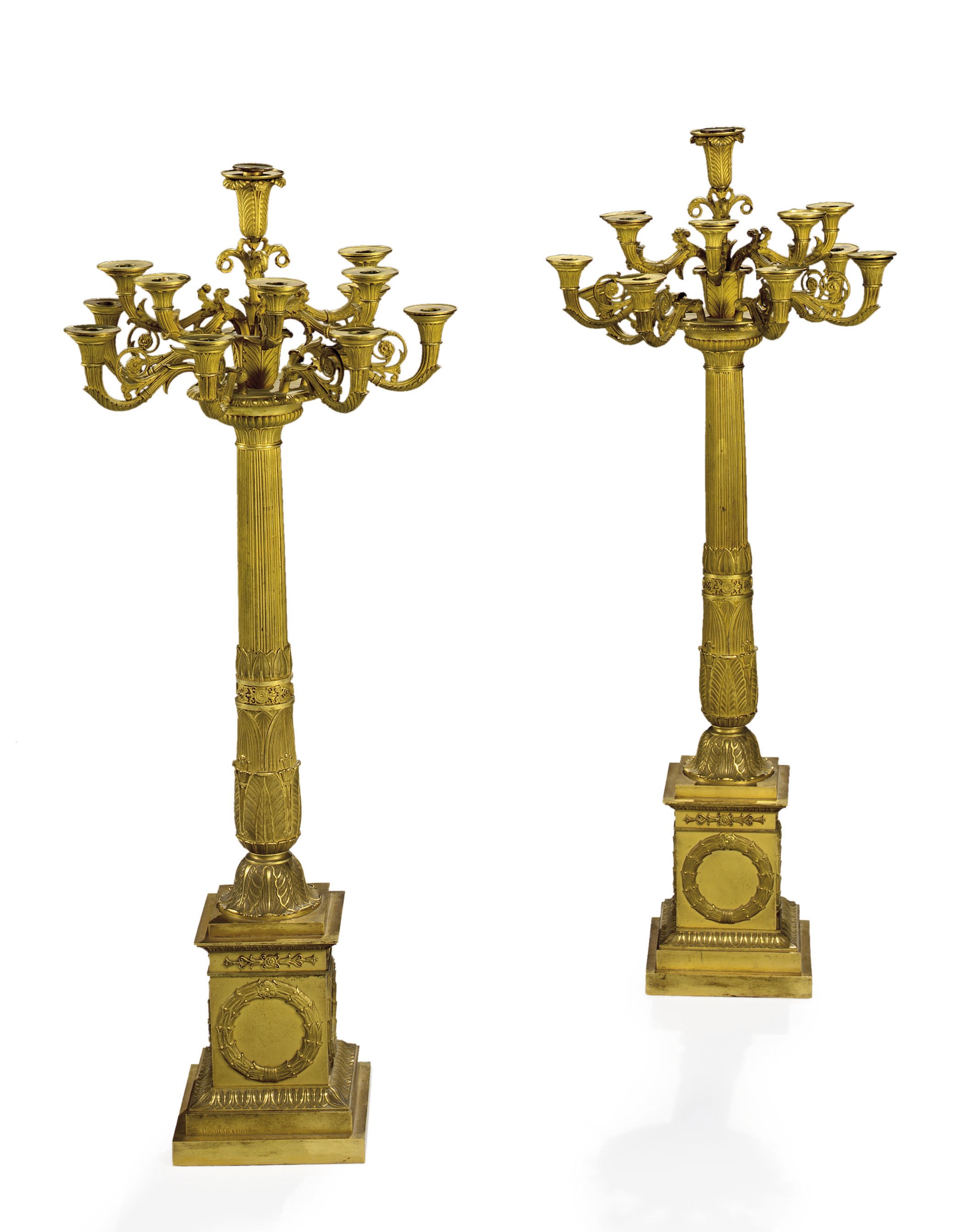 A PAIR OF EMPIRE ORMOLU TWELVE-BRANCH CANDELABRA