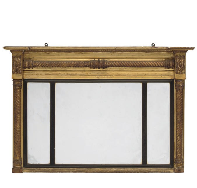 A REGENCY GILTWOOD AND EBONISED OVERMANTEL MIRROR