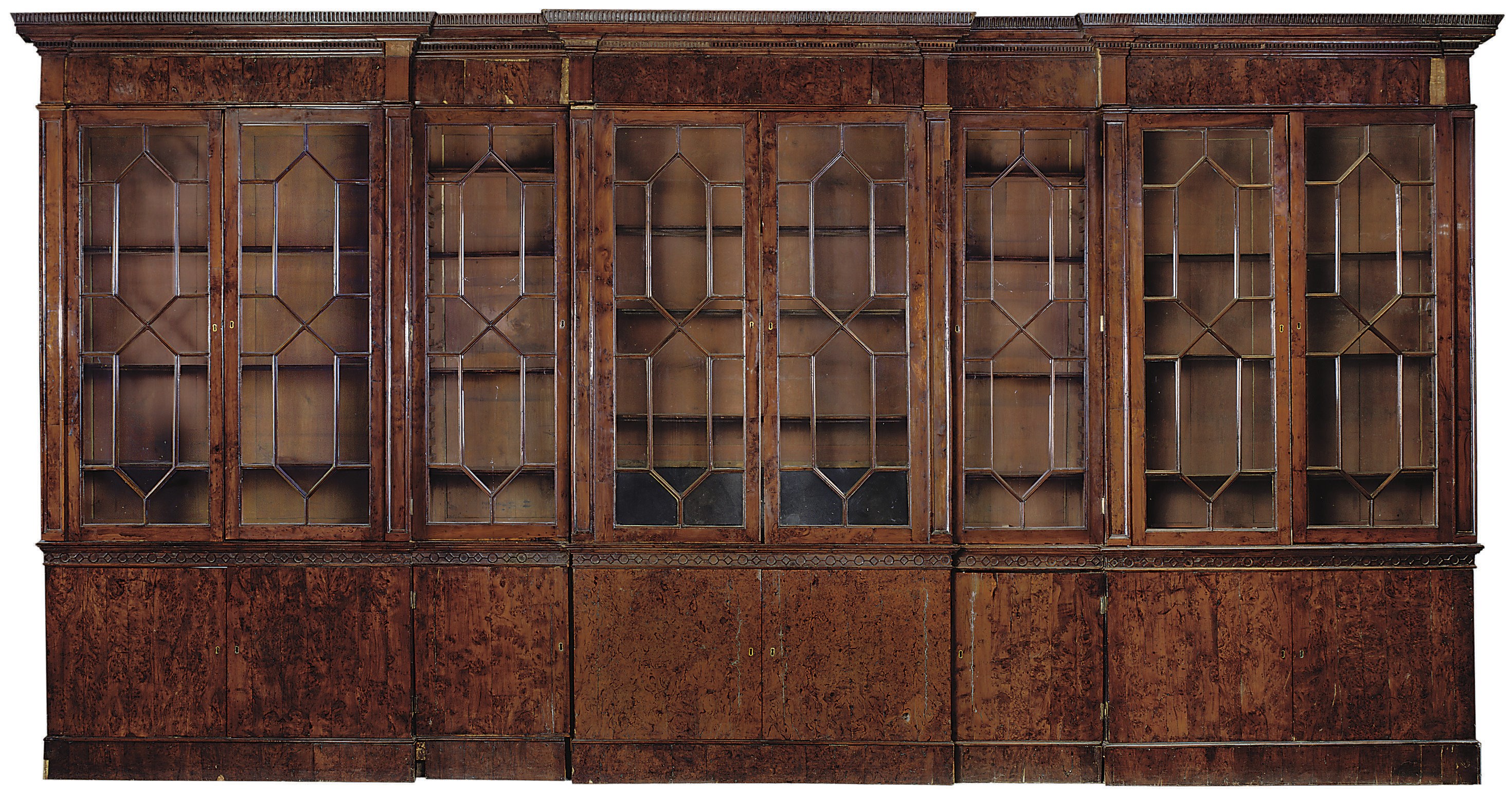 A GEORGE III YEWWOOD DOUBLE BREAKFRONT BOOKCASE