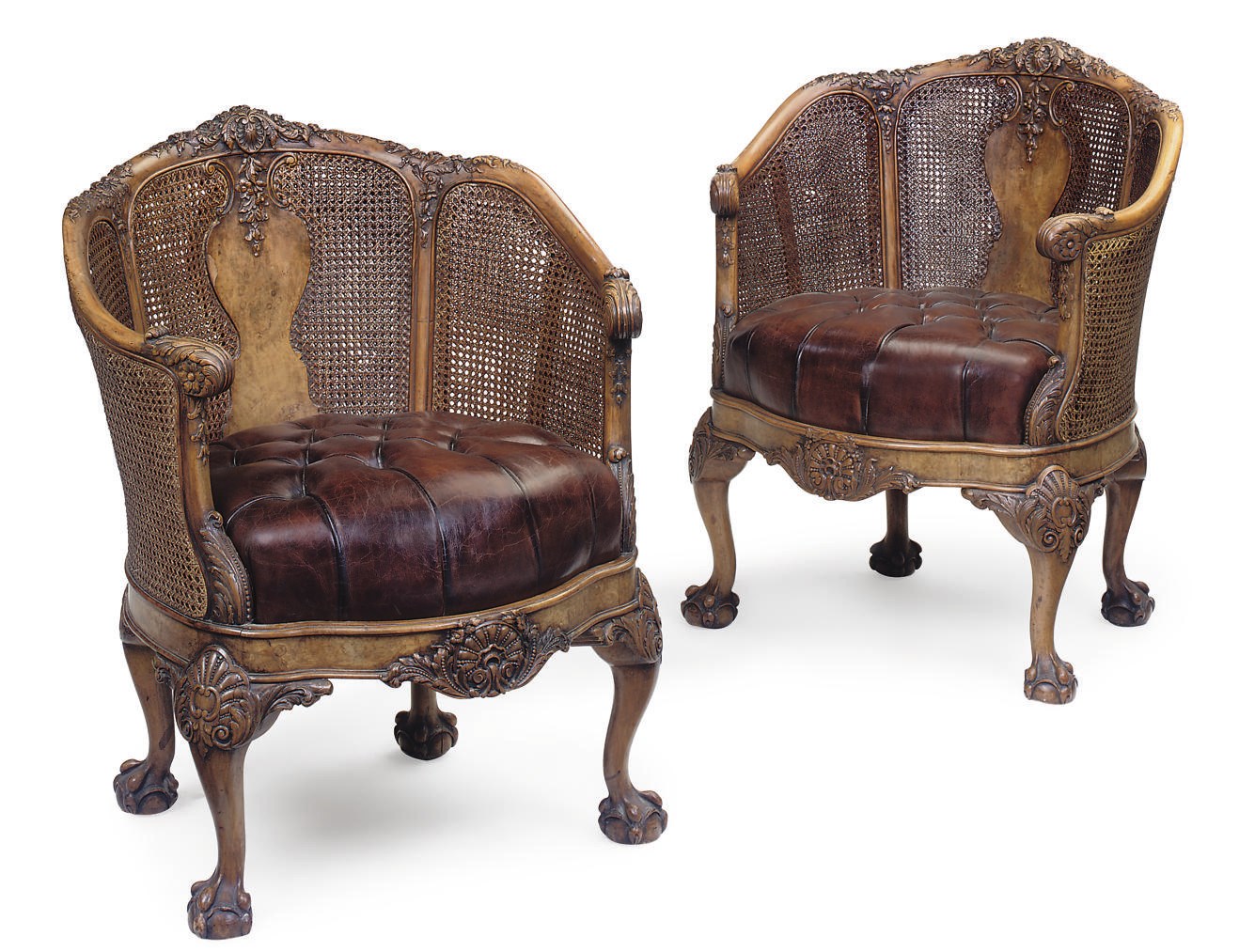 A PAIR OF WALNUT AND CANED TUB ARMCHAIRS