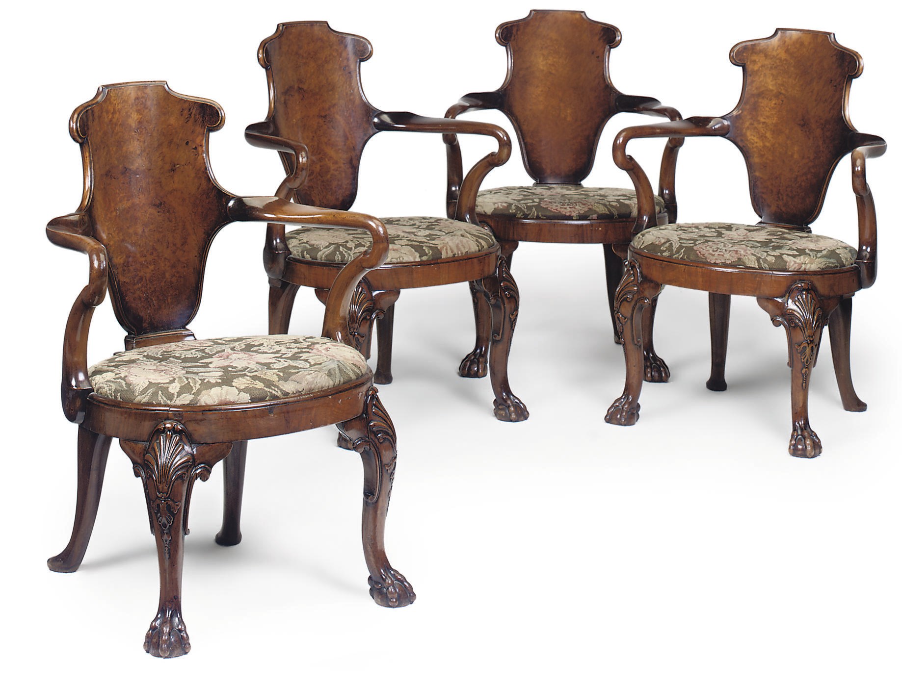 A SET OF FOUR WALNUT AND BURR WALNUT ARMCHAIRS
