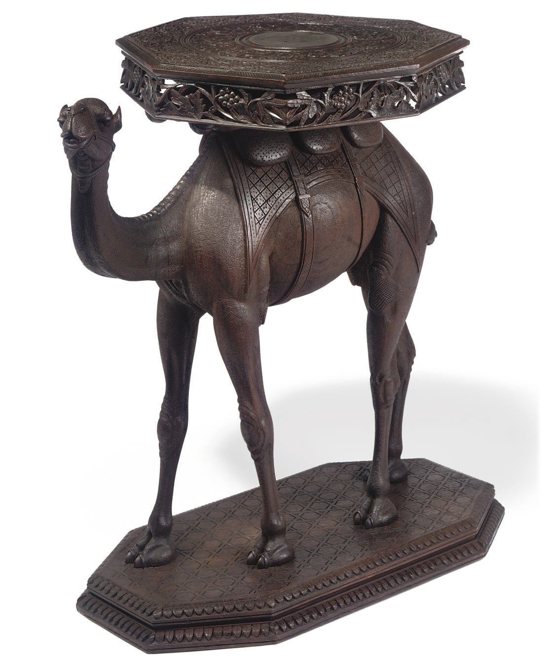 AN ANGLO-INDIAN CARVED TEAK OCCASIONAL TABLE MODELLED AS CAMEL