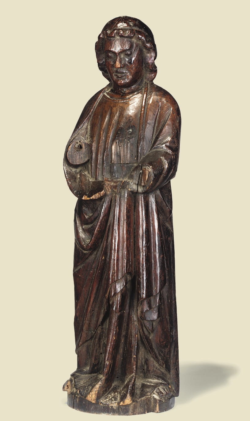 A NORTHERN EUROPEAN CARVED WOOD FIGURE OF A SAINT
