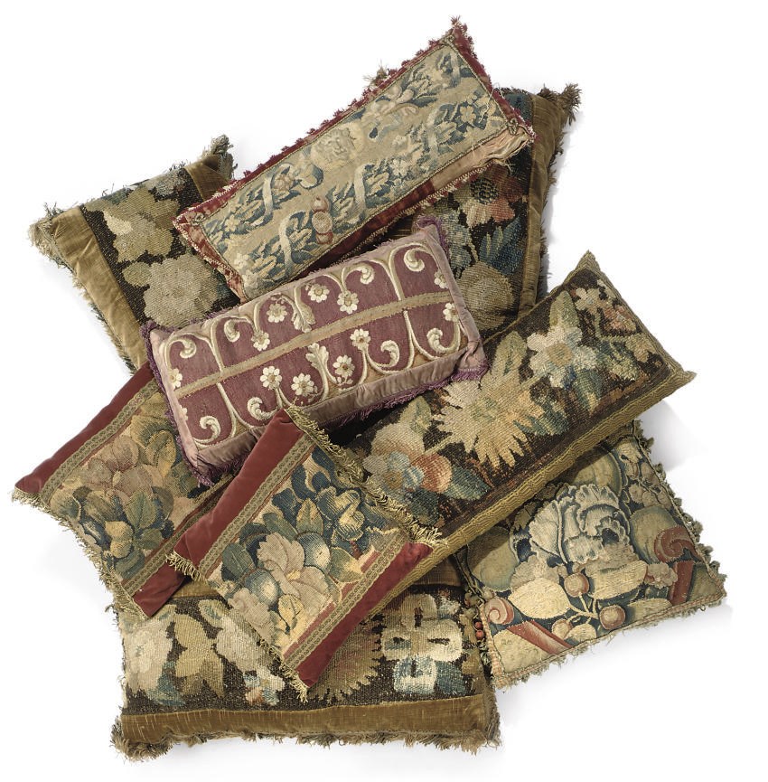 A GROUP OF TAPESTRY CUSHIONS AND A BORDER