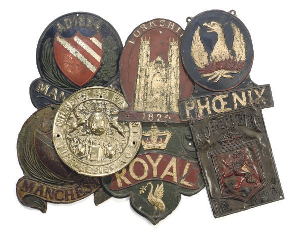 A COLLECTION OF SIX TIN OR COPPER FIREMARKS