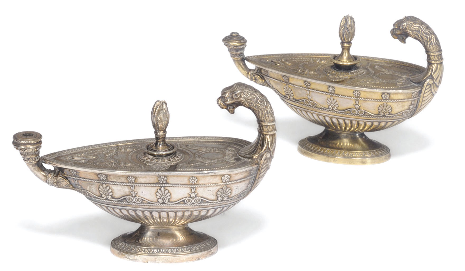 A pair of French silver-gilt table lighters