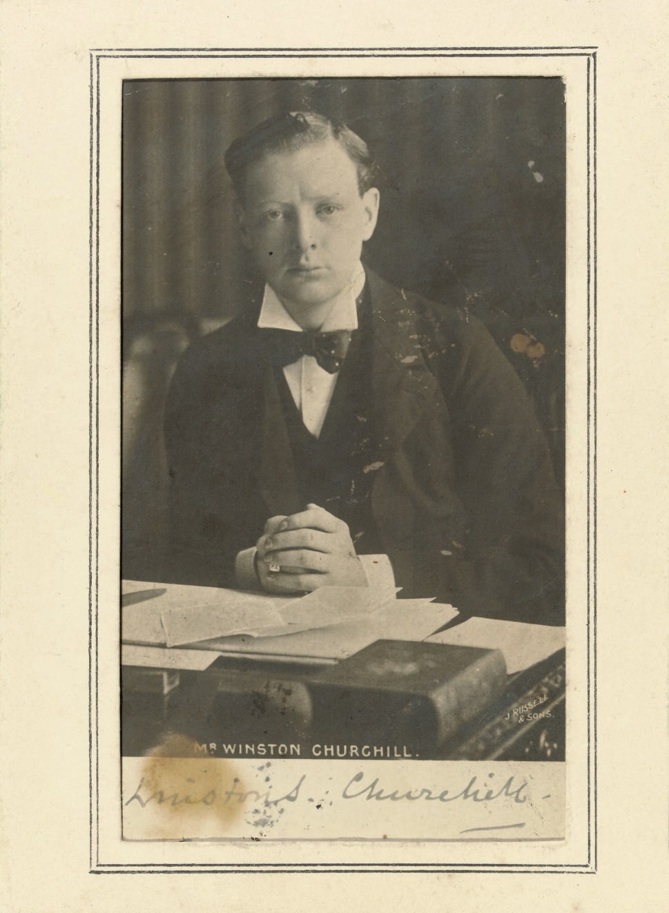 CARTE-DE-VISITE PHOTOGRAPH OF CHURCHILL by J. Russell & Sons (printed on image) signed in ink across bottom panel (browning affecting first six letters) and mounted in an ornate silver frame hallmarked 1900 and decorated with floral designs and figures from mythology (lacks support). Provenance: the Oldham Habitation of the Primrose League.