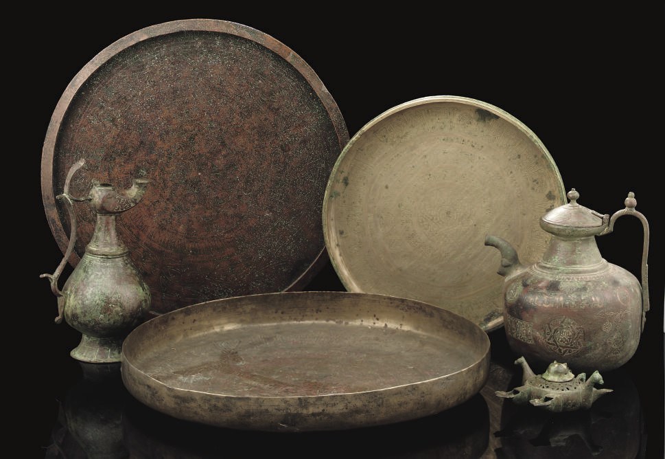 A GROUP OF KHORASAN BRONZE VESSELS AND TRAYS, IRAN, 11TH-12TH CENTURY