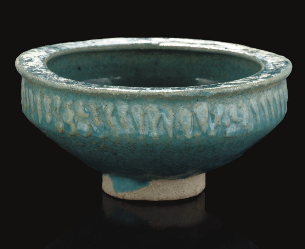 A KASHAN MOULDED TURQUOISE GLAZED BOWL, IRAN, 13TH CENTURY