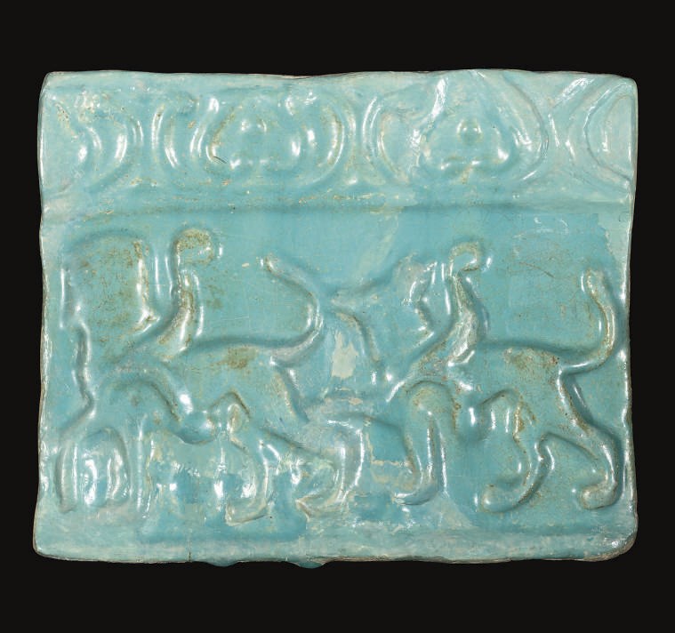 A KASHAN TURQUOISE GLAZED MOULDED POTTERY TILE, IRAN, 12TH-13TH CENTURY