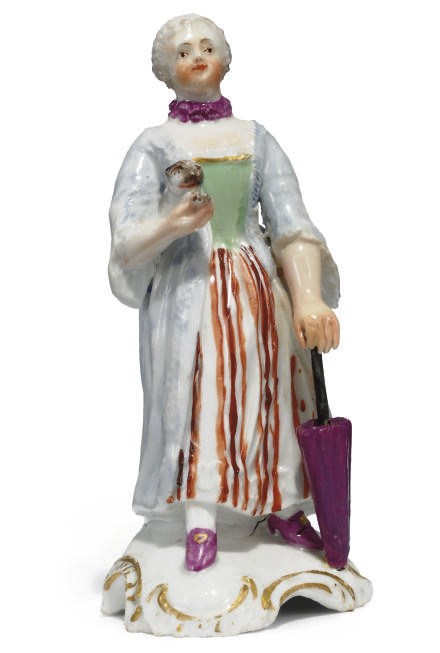 A HÖCHST PORCELAIN FIGURE OF A LADY HOLDING A CAT
