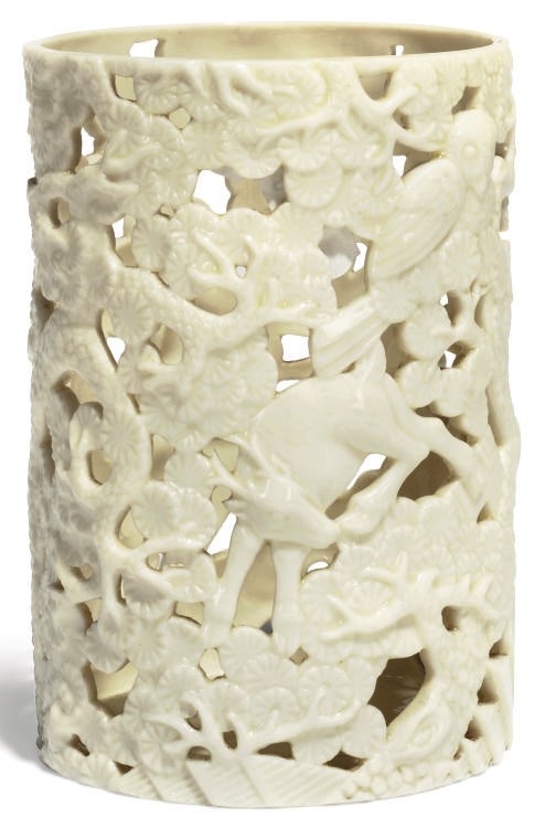 A CHINESE WHITE GLAZED PIERCED BRUSHPOT