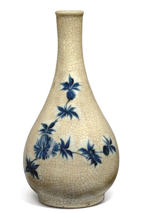 A JAPANESE BLUE AND WHITE CRACKLE GLAZED VASE