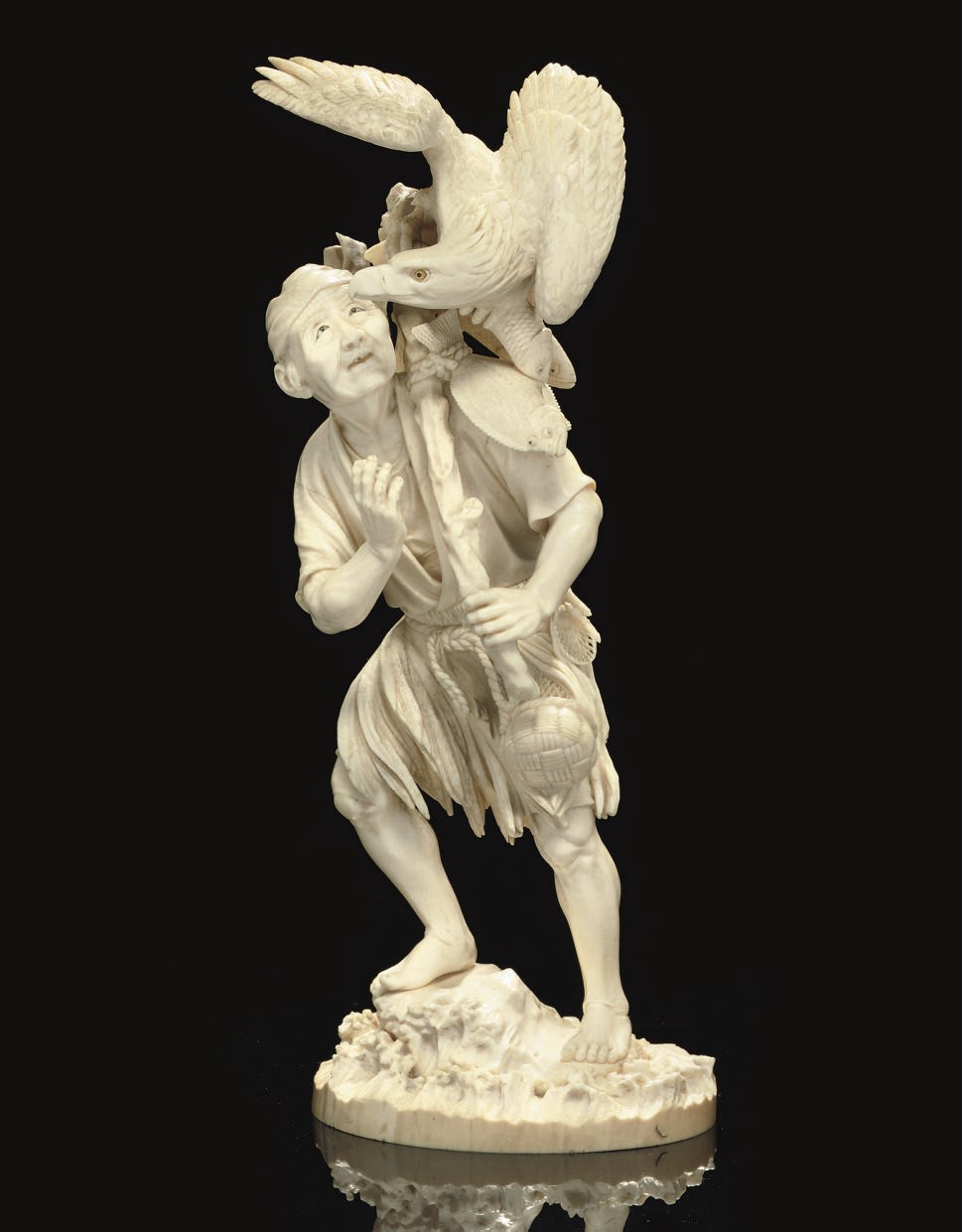 An Ivory Okimono of a Fisherman, Signed Ryusei, Meiji Period (1868-1912)