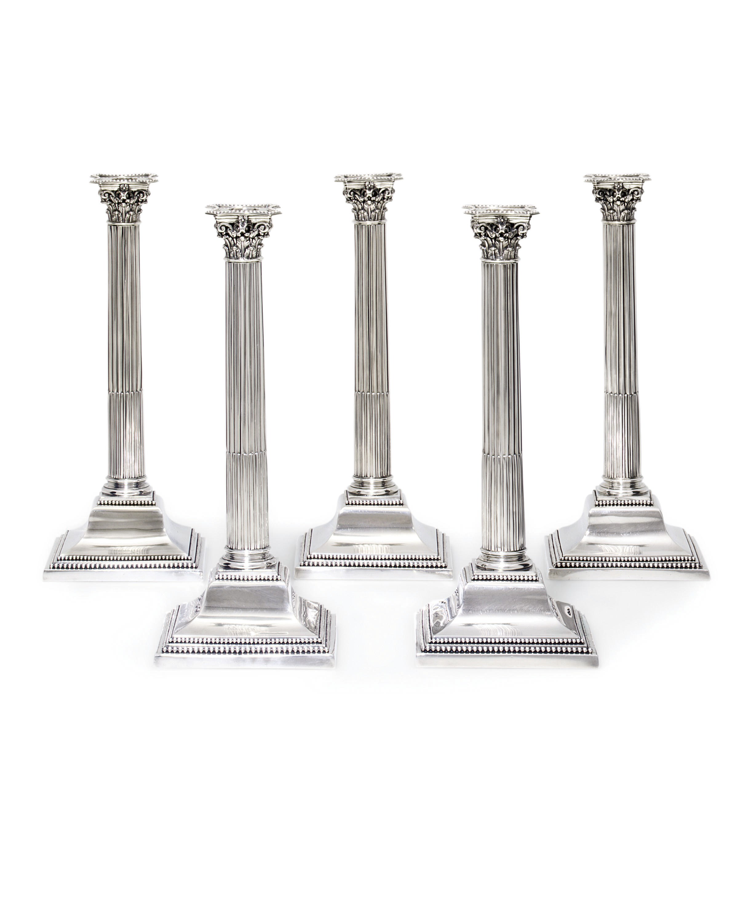 FIVE GERMAN SILVER CANDLESTICKS