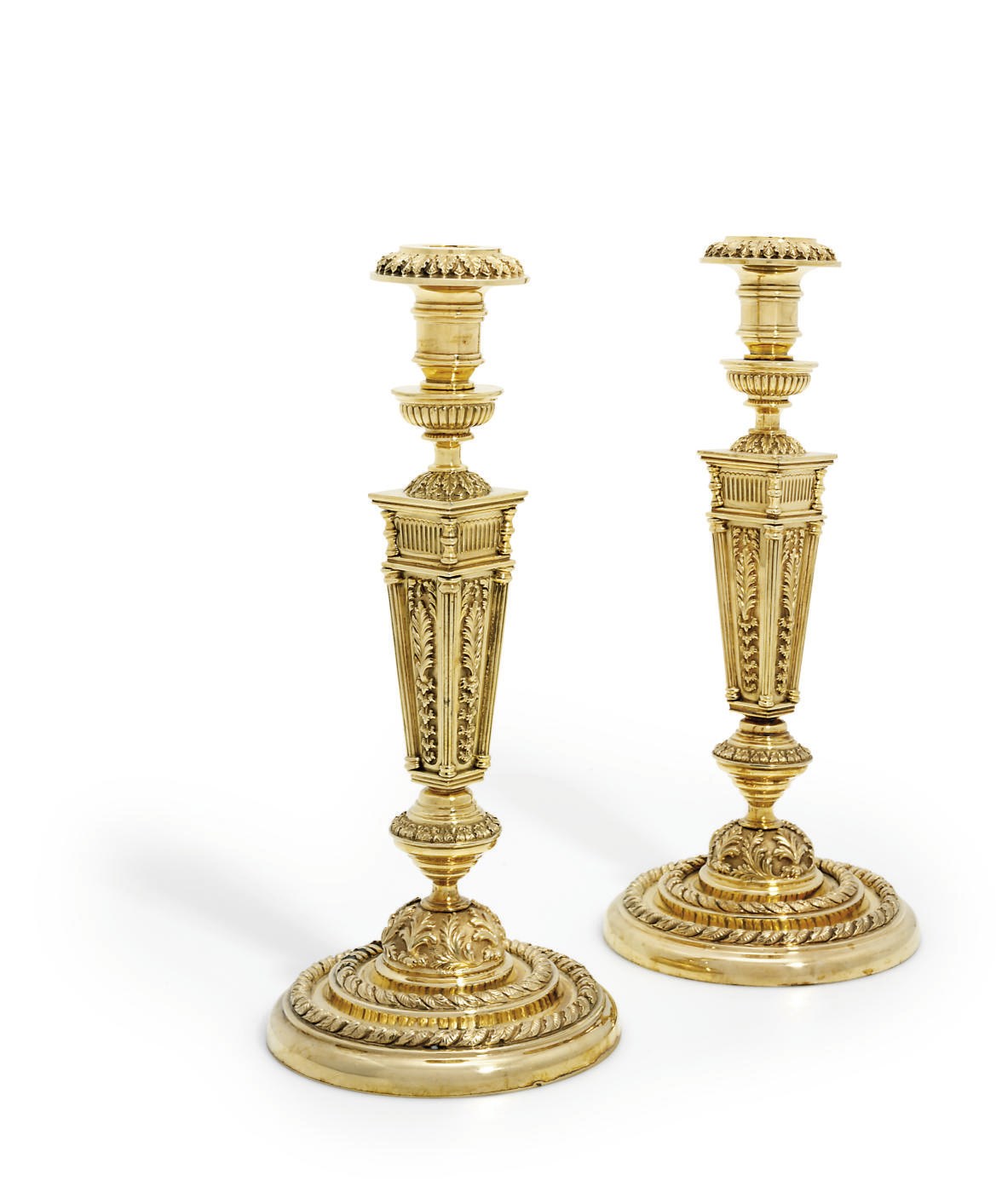 A PAIR OF PORTUGUESE SILVER-GILT CANDLESTICKS
