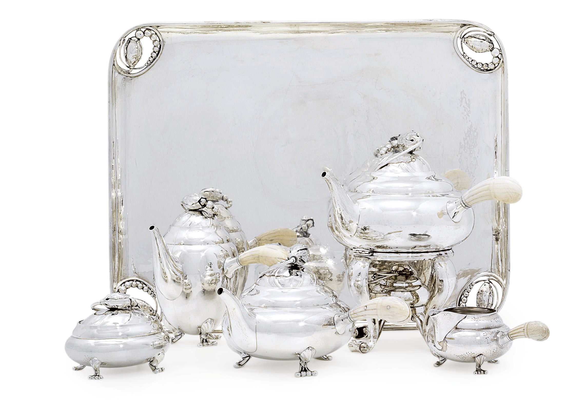 A DANISH FIVE-PIECE SILVER TEA AND COFFEE SERVICE WITH TRAY EN SUITE