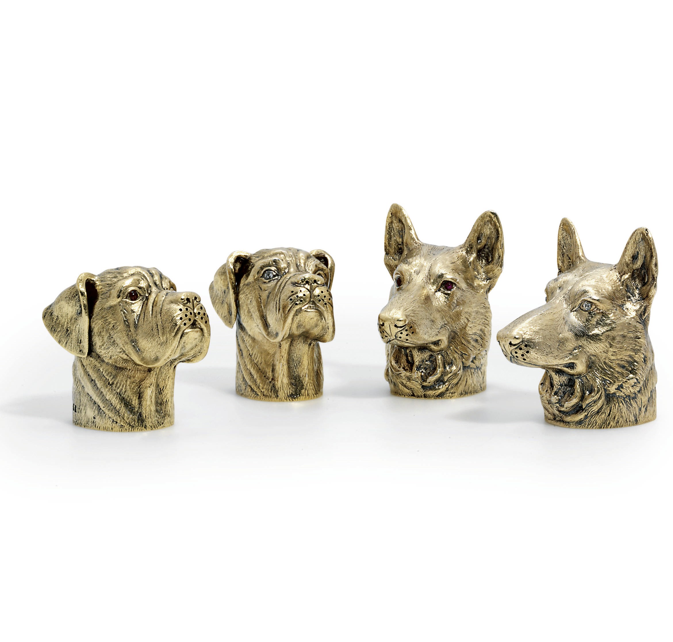 A SET OF FOUR ELIZABETH II SILVER-GILT AND GEM-SET NOVELTY PEPPERETTES