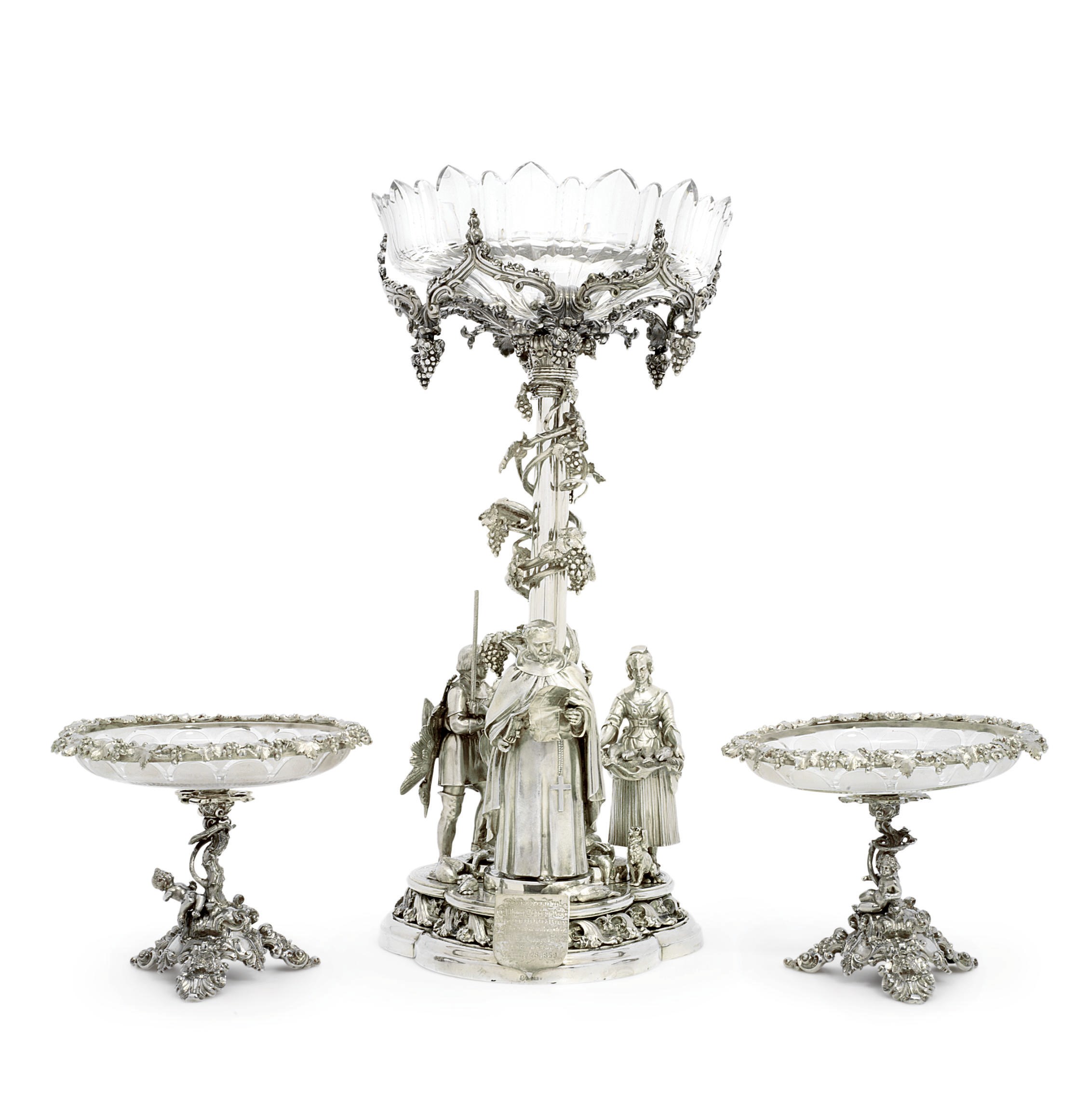 A VICTORIAN SILVER-PLATED CENTREPIECE AND TWO ASSOCIATED DESSERT STANDS