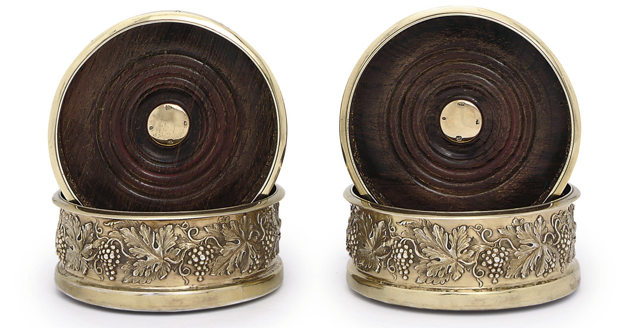 A SET OF FOUR WILLIAM IV SILVER-GILT WINE-COASTERS