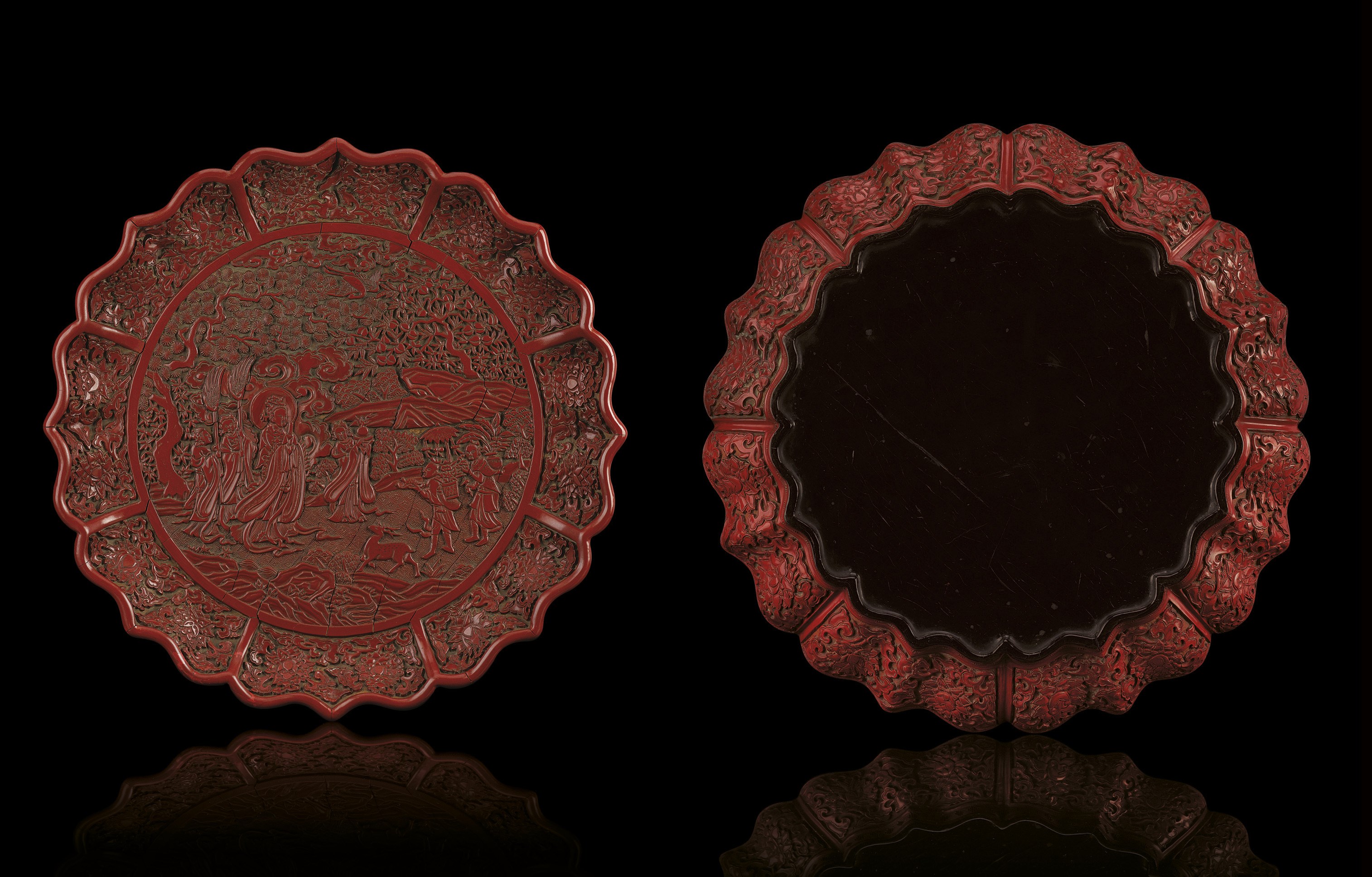 A MAGNIFICENT AND EXTREMELY RARE EARLY MING CARVED 'XIWANGMU' CINNABAR LACQUER FOLIATED DISH