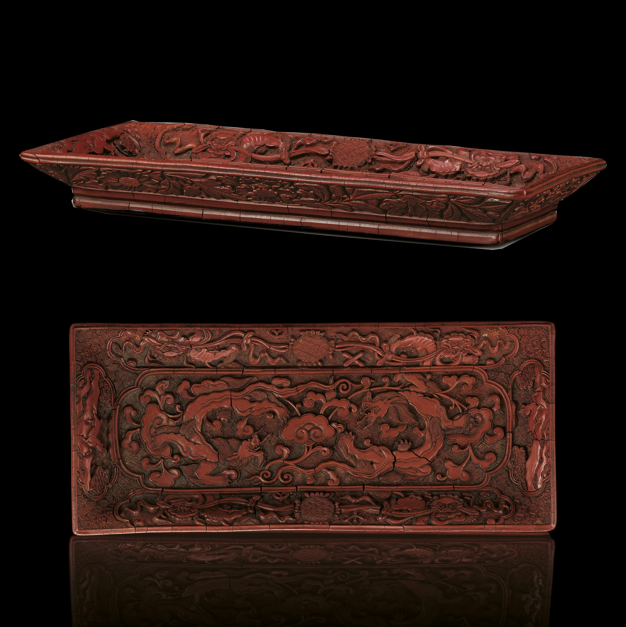 A FINELY CARVED MING CINNABAR LACQUER RECTANGULAR TRAY