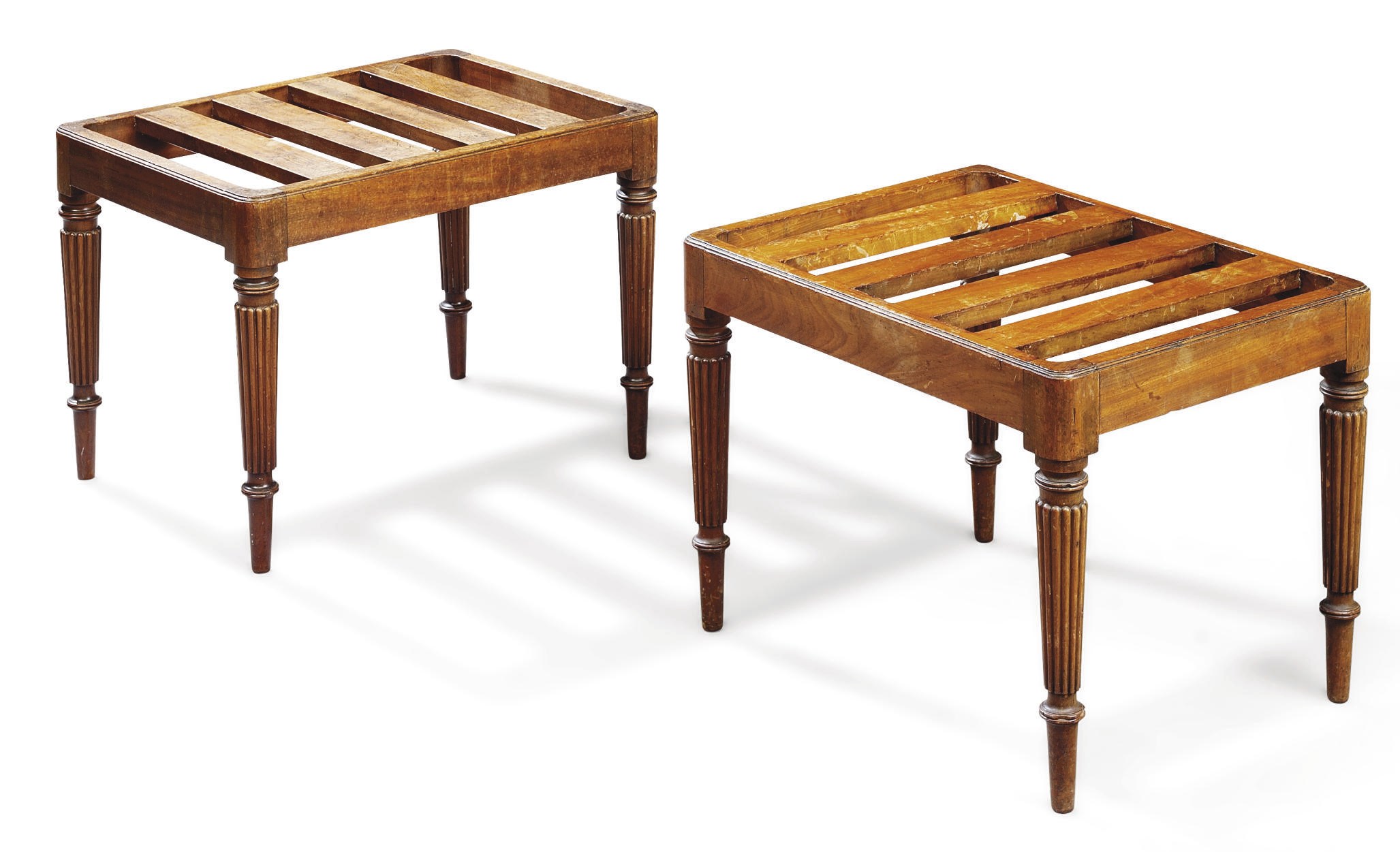 A NEAR PAIR OF REGENCY MAHOGANY LUGGAGE STANDS