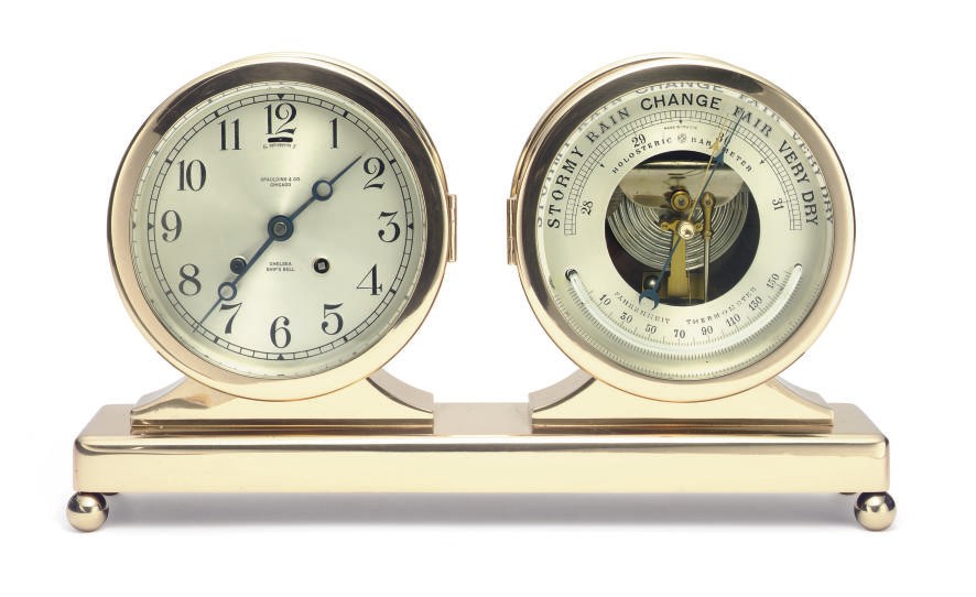 A brass "Columbus"clock and barometer desk set