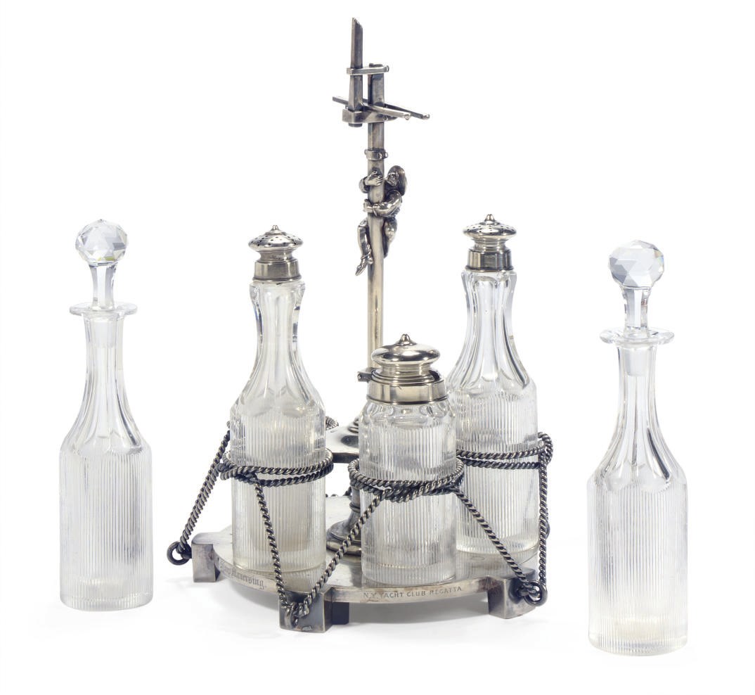 A silver yachting trophy in the form of a cruet set for the New York Yacht Club