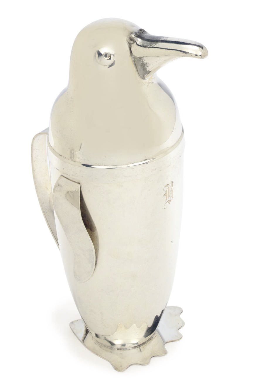 A silver-plated cocktail shaker in the form of a Penguin