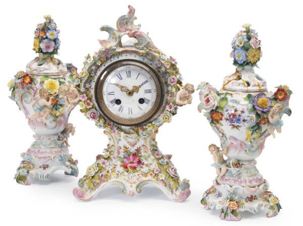 A GERMAN PORCELAIN FLOWER-ENCRUSTED THREE PIECE GARNITURE,