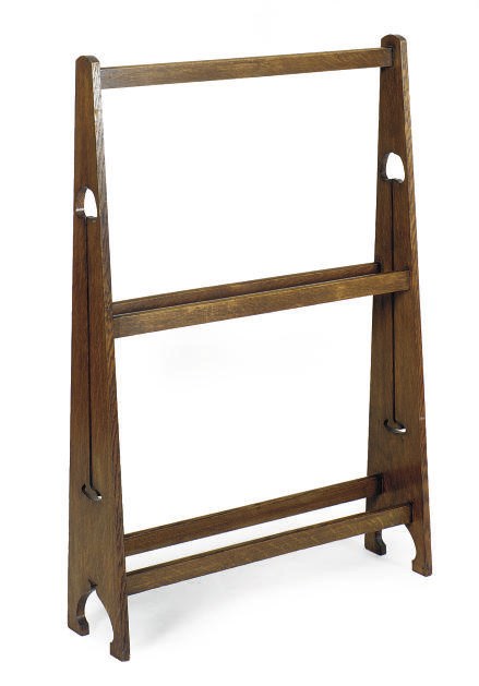 AN OAK CLOTHING RACK,